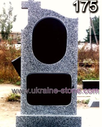 Сірий пам'ятник із хрестом